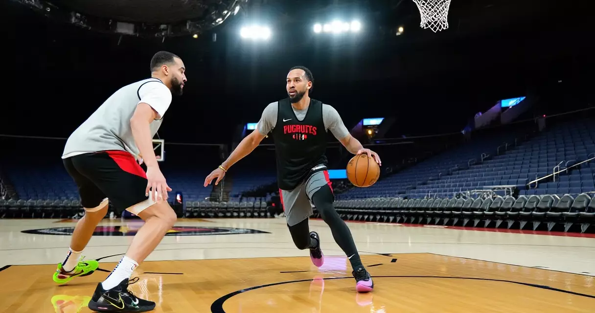 NBA player dribbling on hardwood court during practice session
