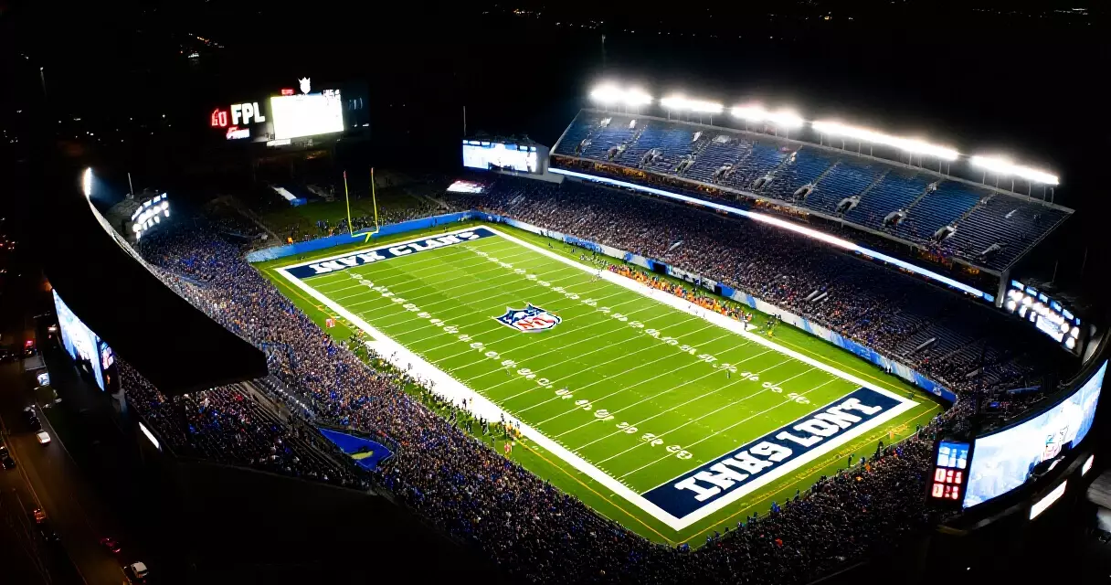 NFL stadium illuminated at night during a Thursday Night Football broadcast