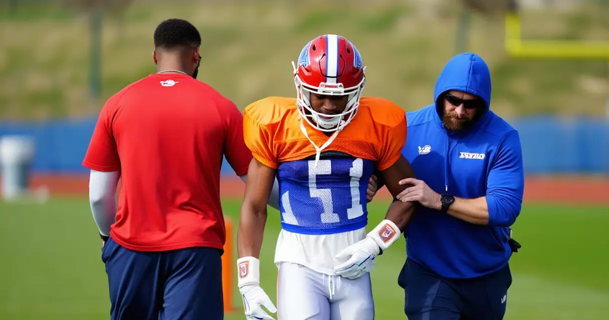 NFL wide receiver helped off practice field after knee injury, Texans colors orange and blue