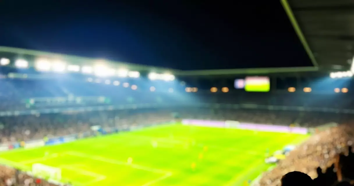 Floodlit football stadium during a Champions League night match
