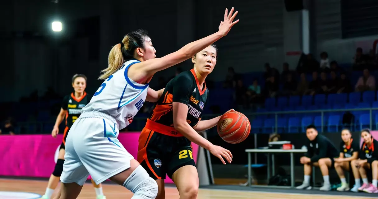 WNBA players competing in an indoor basketball arena during a regular season game